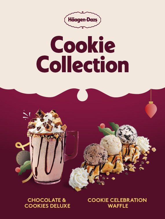 Häagen-Dazs' "Cookie Collection" featuring two festive desserts against a cream and burgundy holiday-themed background. On the left, a Chocolate & Cookies Deluxe drink in a clear glass mug topped with whipped cream, chocolate drizzle, and cookie pieces. On the right, a Cookie Celebration Waffle with scoops of ice cream, whipped cream, chocolate drizzle, cookie bits, and waffle segments, garnished with golden sprinkles and chocolate stars.